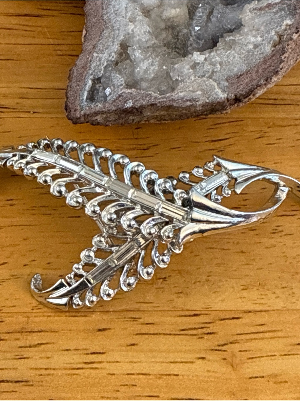 Restored Corocraft rhodium plated silver tone fern brooch  with clear baguettes